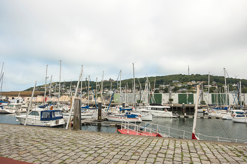 Etretat, France - August 20, 2018: Moored sailboats and yachts in the harbor in Etretat. Normandy, France