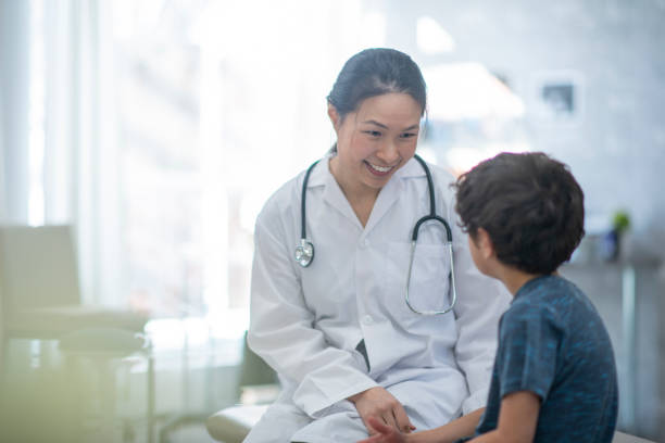Doctor speaking to little boy