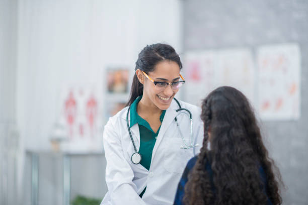 istock Smiling doctor with patient 1082117584