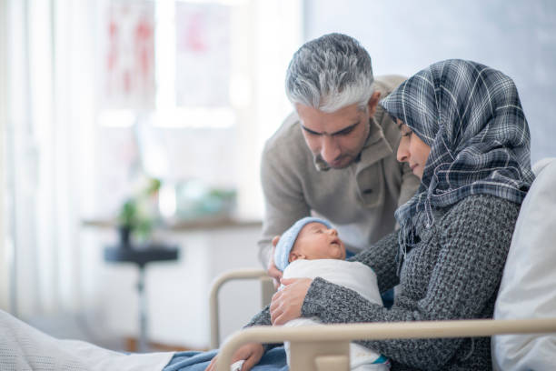 istock Newborn baby and parents 1082119916