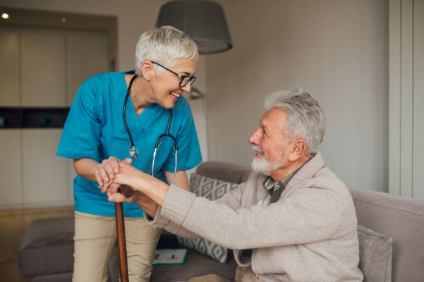 istock Nurse looking at patient with a cane 1082127258