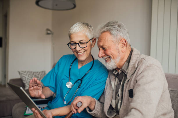 istock Happy senior people with digital tablet 1082128320