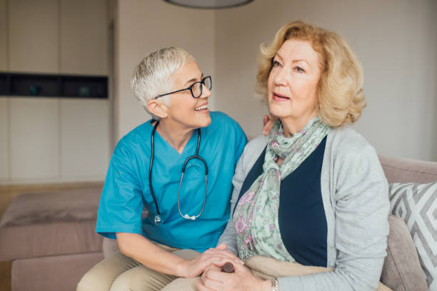 istock Nurse comforting patient 1082138978