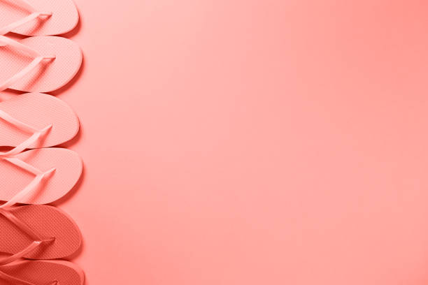 istock Flip flops in a row. Coral 1082139032