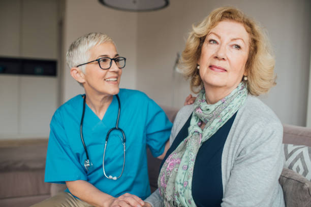 istock Woman sitting by the nurse 1082139524