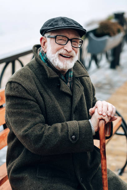 istock Positive delighted mature man looking straight at camera 1082139620