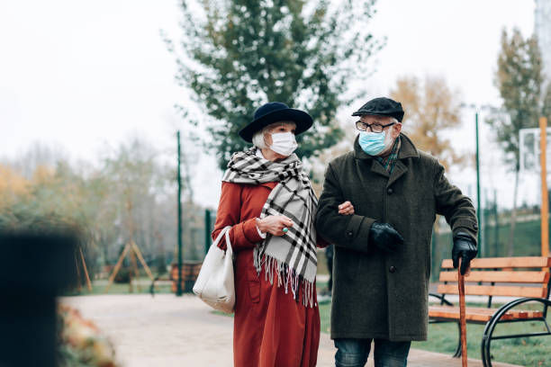 istock Cheerful elderly people walking during city epidemic 1082139762
