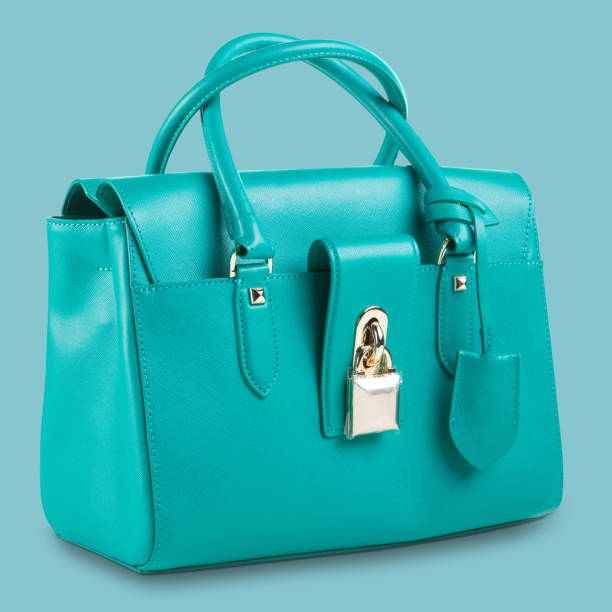 istock new turquoise women bag on a blue pastel background 1082155444