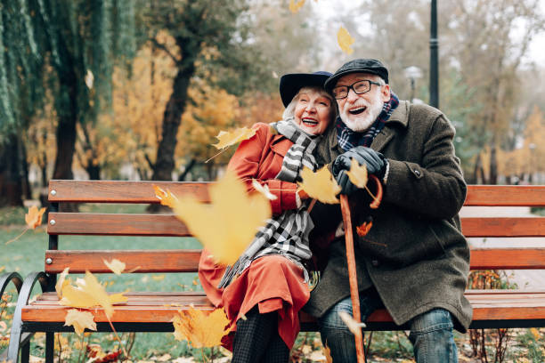 istock Cheerful elegant woman embracing her mature partner 1082157934