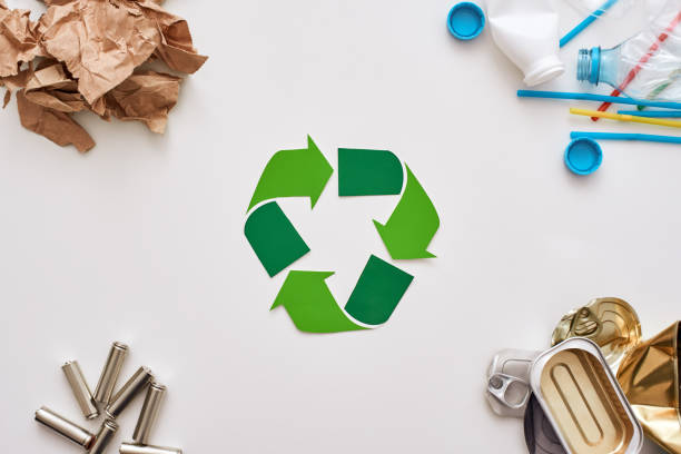 istock Four types of garbage. Batteries, canns, paper and plastic in the corners 1082165852