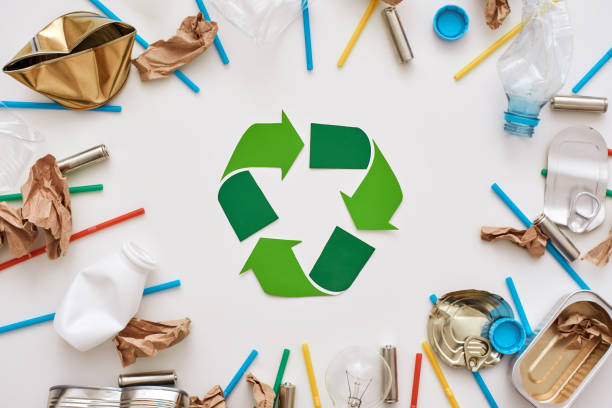 istock Garbage circle. Different types of garbage around the recycling symbol 1082165866