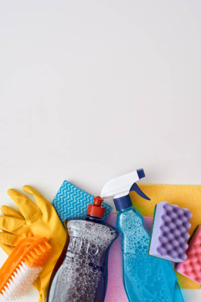 istock Cleaning tools. Spray bottle and other items isolated 1082169274