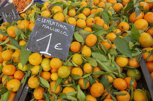 Clementine fruits on display in a winter market in Mallorca, Spain.