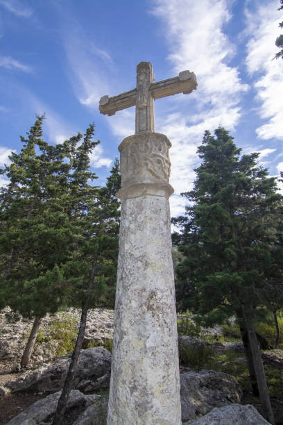 istock White stone cross standing on sculptured limestone base 1082183062