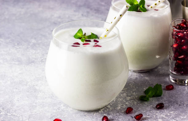 istock White cocktail coconut Mojito drink onlight background. 1082185532