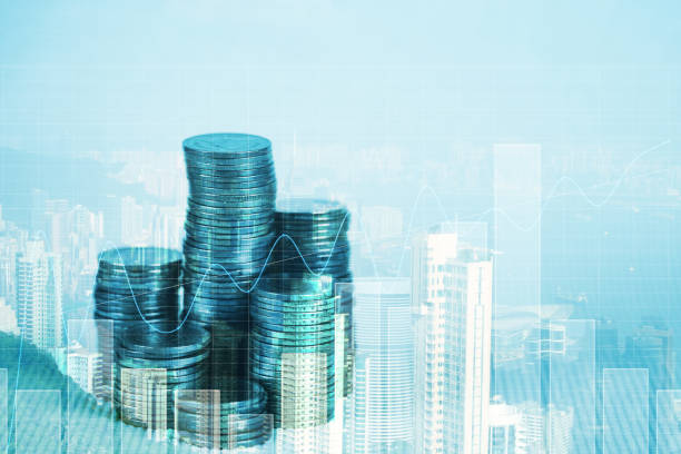 istock Double exposure of coin stack with financial graph over city and office building background, business and financial concept. 1082186820