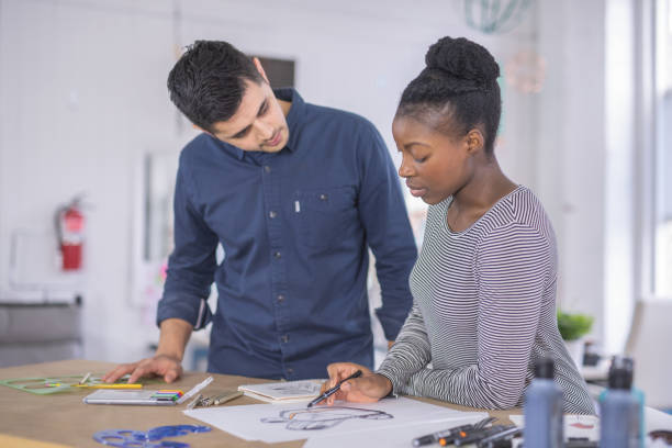 istock Design couple strategize in their modern studio 1082191244
