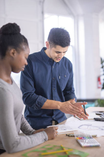 istock Design couple strategize in their modern studio 1082191262