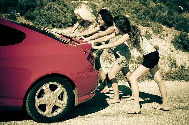 istock girls are pushing the car 108219129