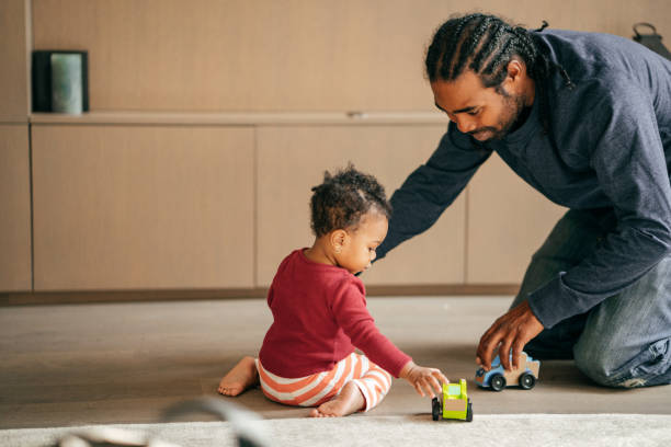 istock Father playing with baby daughter 1082195016