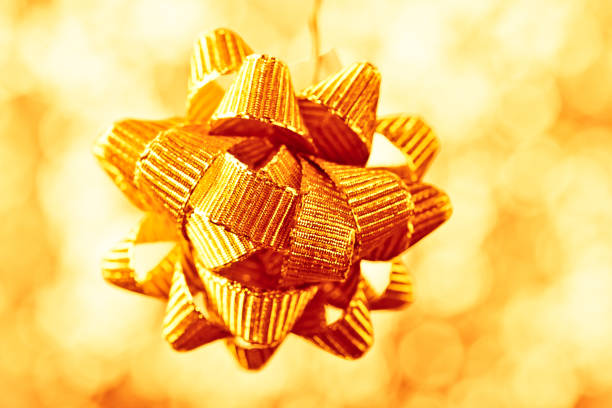 beautiful golden bow on shiny background