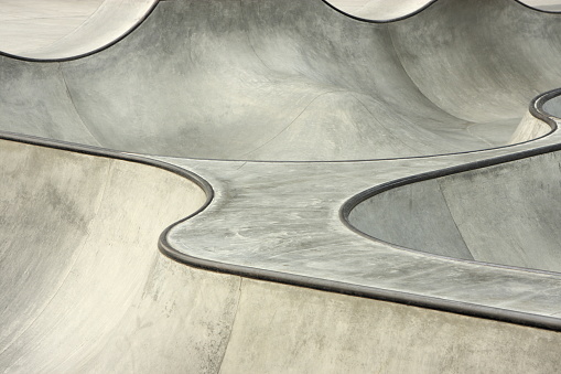 Lines and curves of a concrete surface skateboard and BMX bike park.  No graffiti.  Port Angeles, Washington, 2008.