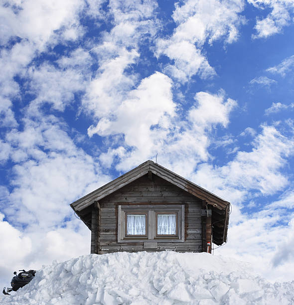 A serene view of steep-slope roofs covered in fresh snow, showcasing architectural details and the tranquility of winter in France.