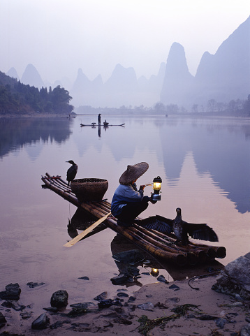 Yangshuo County, Guilin, Guangxi, China - July 29, 2023: Many tourists enjoying themselves along the Lijiang River