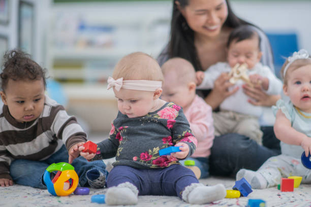 istock Little babies playing with toys 1082198616