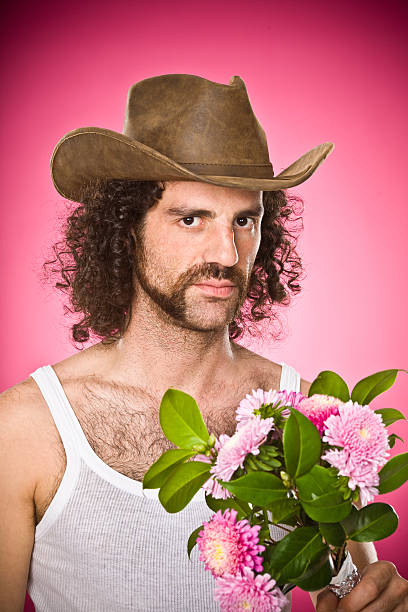 shabby cowboy parody portrait on pink  gay long hair stock pictures, royalty-free photos & images
