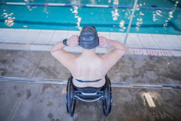 istock Adaptive athlete prepares to swim in a pool 1082202160