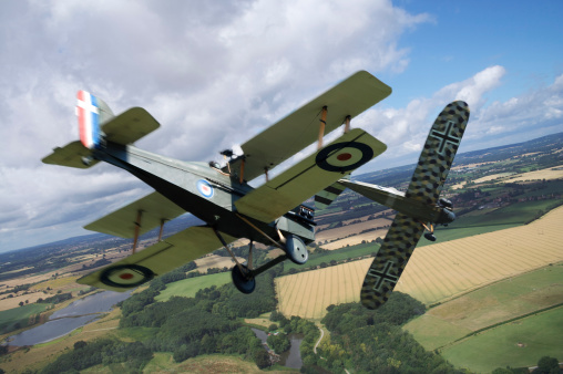 A classic Mk 1 Spitfire flies over the British countryside. Model photography.