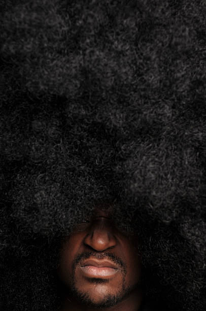istock Man with Large Afro Hairstyle Sneering 108220235