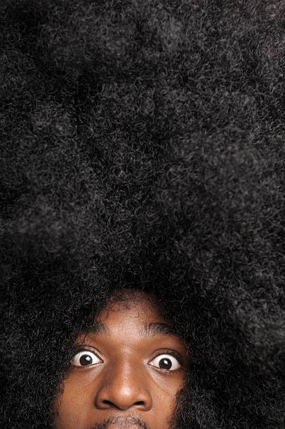 jeune homme avec une grande coiffure afro - copy space one person vertical 1970s style photos et images de collection