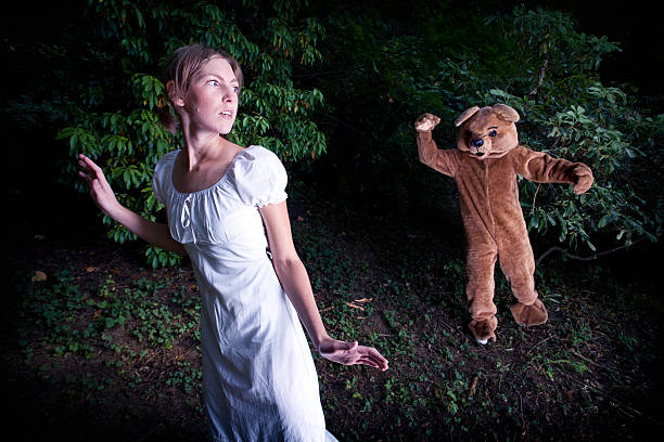 Costumed Bear Chasing A Young Woman