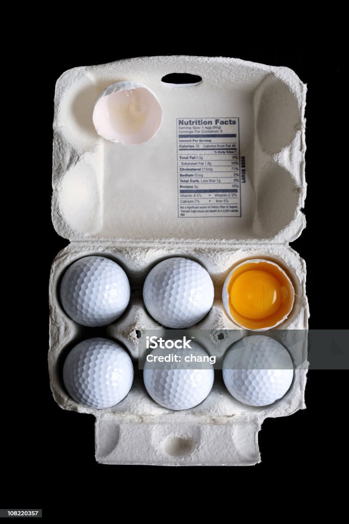 Balles de Golf avec Boîte à oeufs avec un affichage de Broken Yolk - Photo de Balle de golf libre de droits