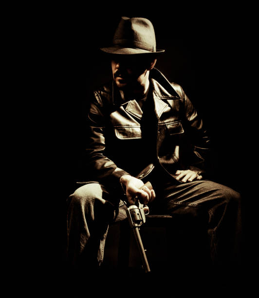 Isolated 3d render illustration of male detective or mobster with gun silhouette standing on white background.