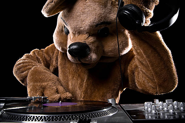A bear DeeJay kicks out the club tunes, holding his stereo headphones to his ear while spinning / scratching the vinyl record.\n[url=file_closeup?id=25612179][img]/file_thumbview/25612179/1[/img][/url] [url=file_closeup?id=7423313][img]/file_thumbview/7423313/1[/img][/url] [url=file_closeup?id=32465122][img]/file_thumbview/32465122/1[/img][/url] [url=file_closeup?id=25109644][img]/file_thumbview/25109644/1[/img][/url] [url=file_closeup?id=7389823][img]/file_thumbview/7389823/1[/img][/url] [url=file_closeup?id=7389825][img]/file_thumbview/7389825/1[/img][/url]