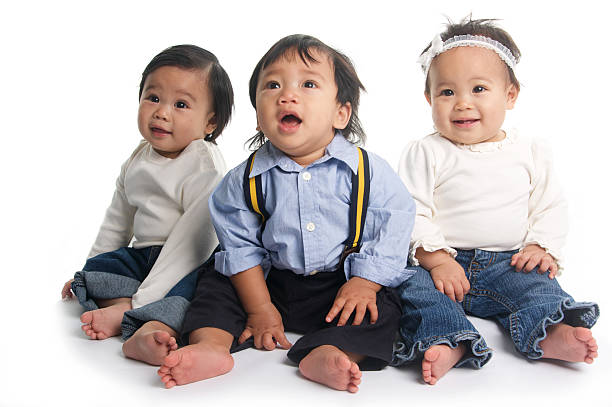 istock Three Asian Babies Sitting Up With White Background 108220817