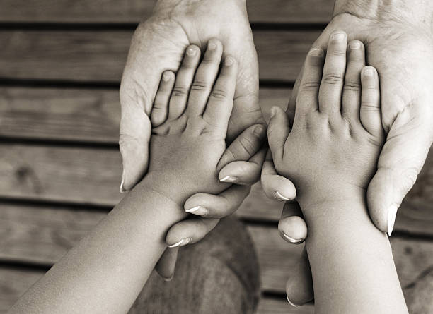 istock Adult Holding Child's Hands 108220872