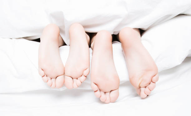 istock People's Feet Sticking out from Covers 108220906