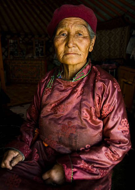 porträt von senior mongolische frau - rawpixel stock-fotos und bilder