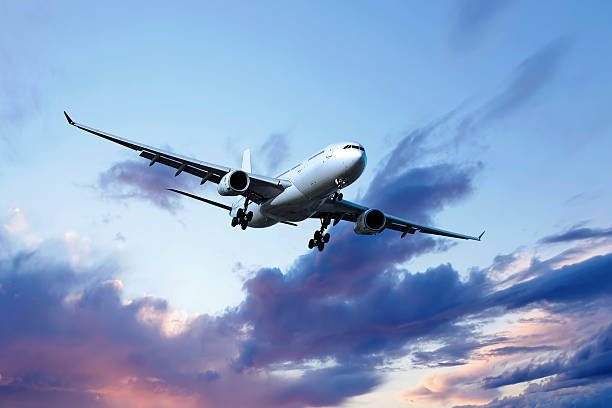 istock XL jet airplane landing at dusk 108221018