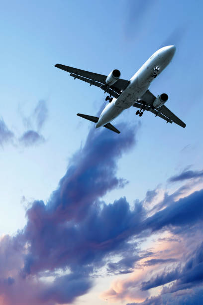 istock jet airplane landing at dusk 108221019