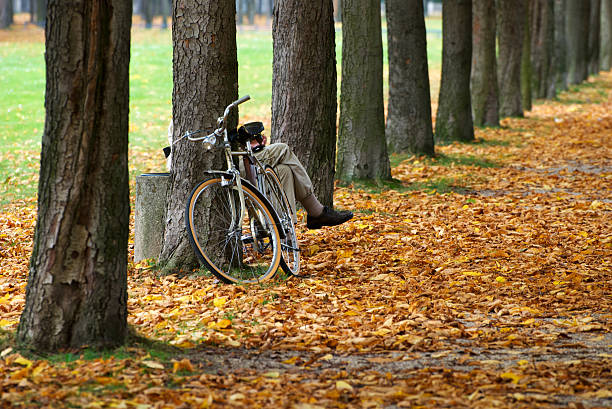 Albany, USA - May 19, 2024. A man resting on lawn at Washington Park in Summer, Albany, New York, USA