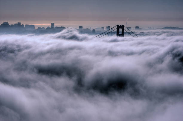 San Francisco California - December 21 2024: Buildings in Downtown San Francisco Near Union Square at Dusk with Fog Covering some of the Towers