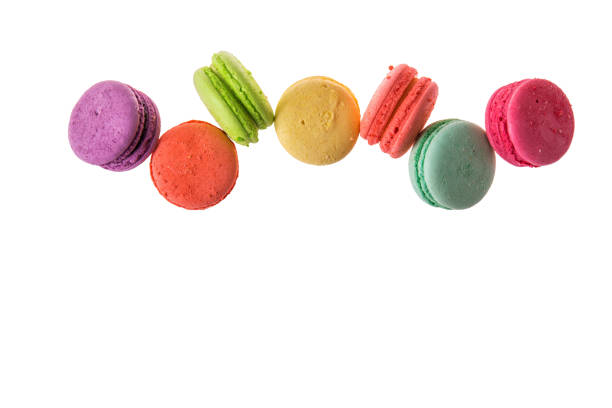 istock Flat lay, top view. Close up. Sweet macaroons isolated on white background. Copy space below. 1082213004