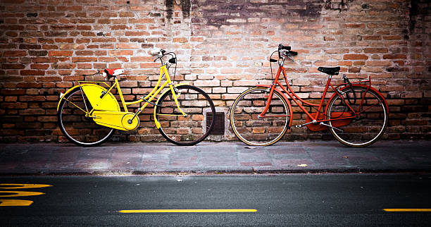 istock Bicycles Leaning Against Brick Wall City Street 108221400