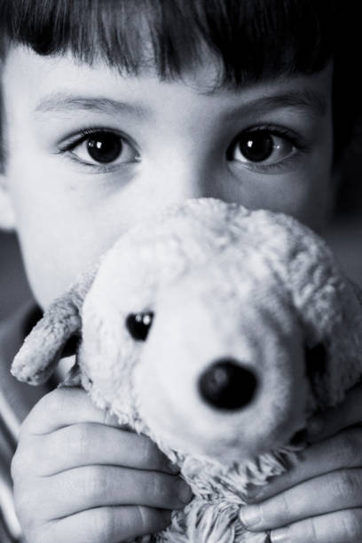 istock Little Boy Hiding Face Behind Stuffed Animal 108221541