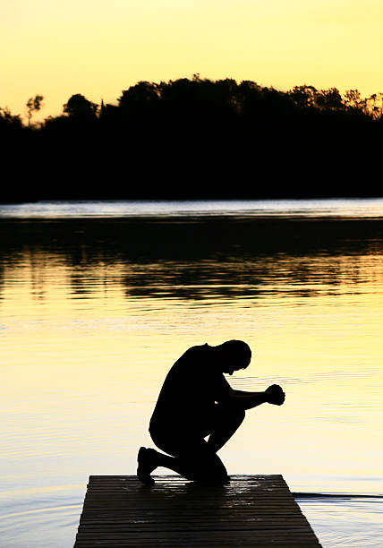 istock Silhouette of Middle Aged Man in Prayer 108222001